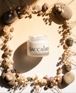 Flat lay of Saccahra's product centered inside a rustic, circular wreath made of dried leaves, seed pods, and twigs